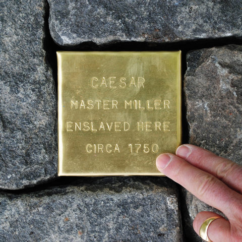 Touching Stone installed in a cobblestone street