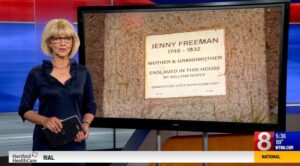 News anchor reporting on Jenny Freeman's gravestone, highlighting her life as a mother and grandmother.