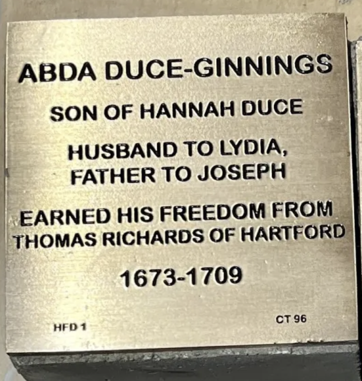 Plaque honoring Abda Duce-Ginnings, family details, and freedom from Thomas Richards of Hartford, 1673-1709.