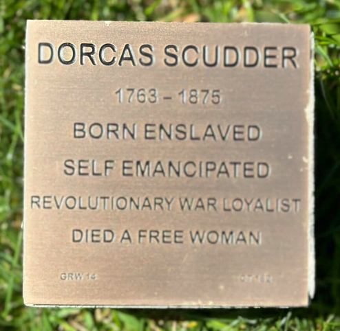 Plaque honoring Dorcas Scudder: born enslaved, self-emancipated, Revolutionary War loyalist, died free (1763-1875).