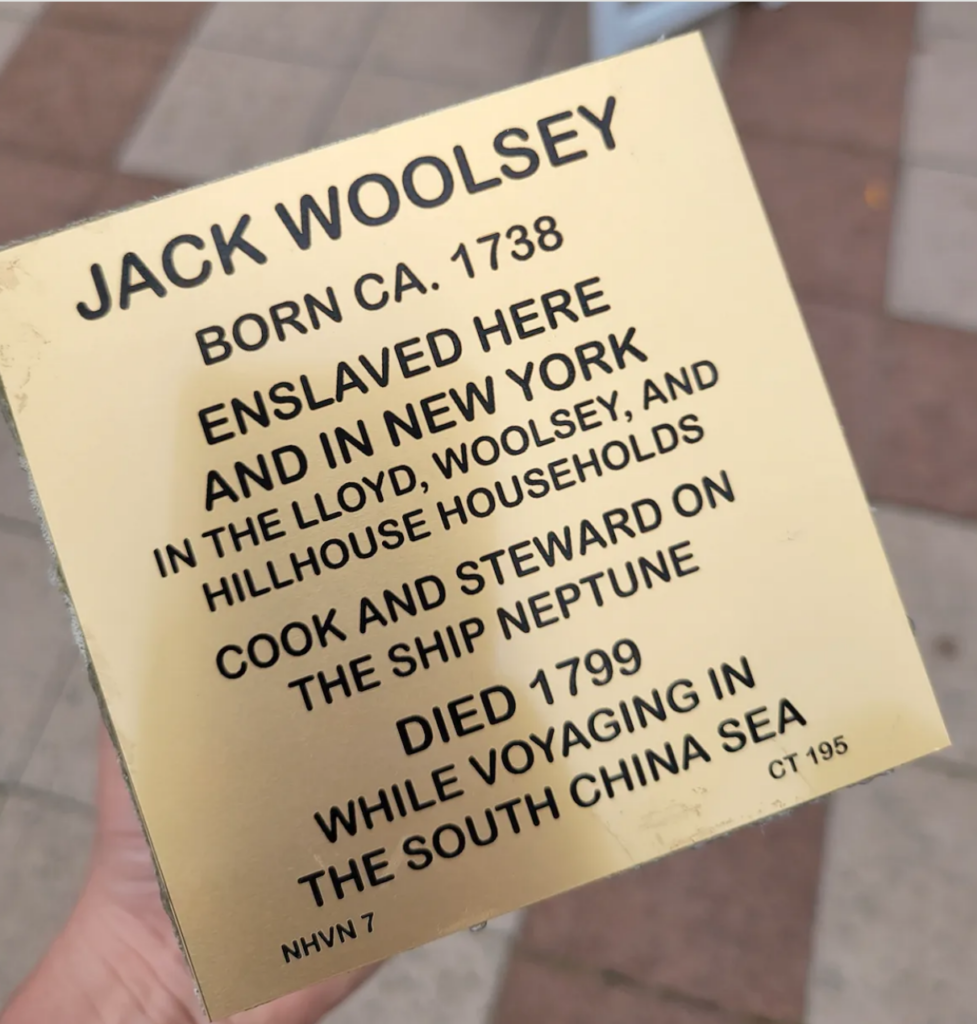 Plaque honoring Jack Woolsey, born 1738, depicting his life as an enslaved individual and sea steward who died in 1799.