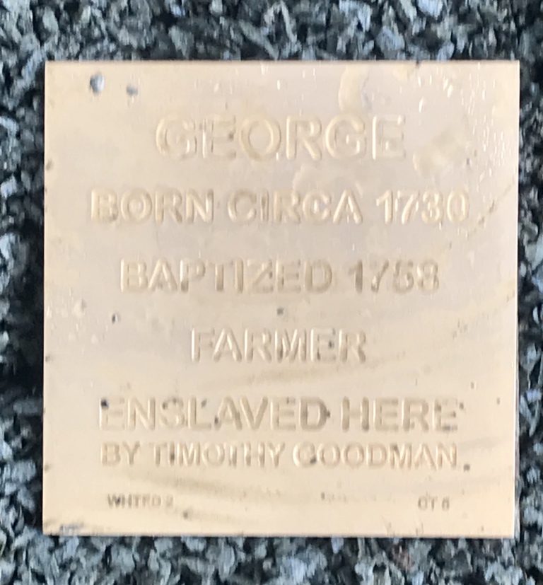 Memorial plaque for George, born circa 1730, farmer, noting enslavement by Timothy Goodman.