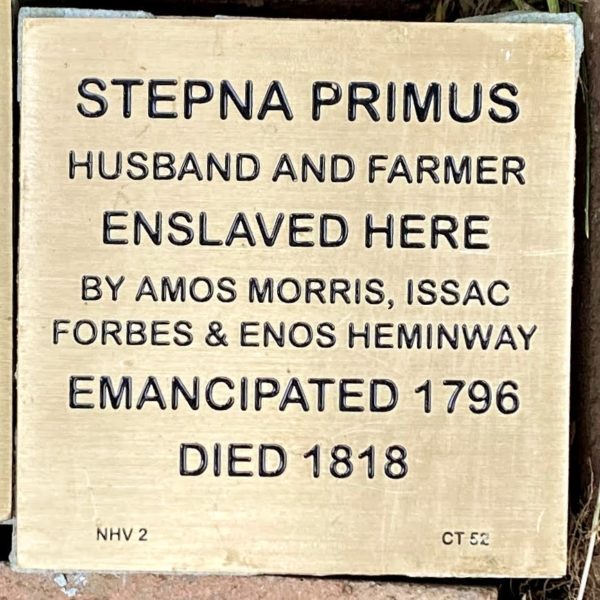 Historical plaque for Stepna Primus, enslaved and emancipated in 1796; details of enslavers, died 1818.