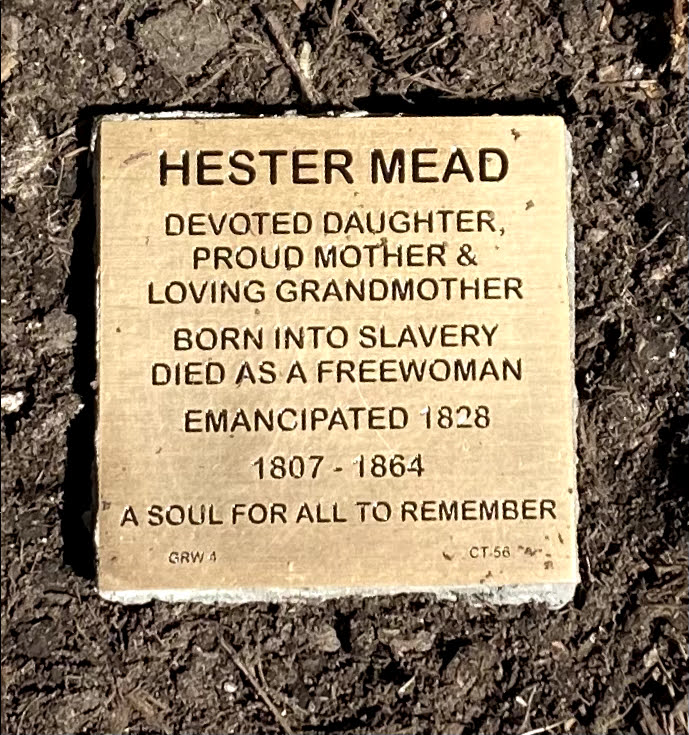 Bronze plaque honoring Hester Mead, mother and grandmother, born into slavery, emancipated 1828, died a free woman.