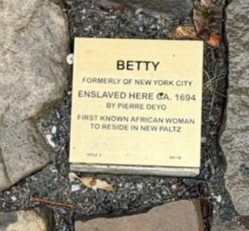 Commemorative plaque for Betty, the first known African woman in New Paltz, detailing her enslavement history.