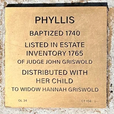 Gold plaque commemorating Phyllis: Baptized 1740, inventoried 1765 in Judge John Griswold's estate, with her child to Hannah Griswold.