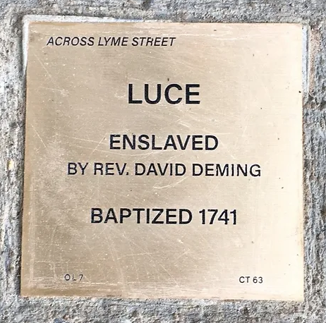 Commemorative plaque for Luce, enslaved by Rev. David Deming, baptized in 1741, located across Lyme Street.