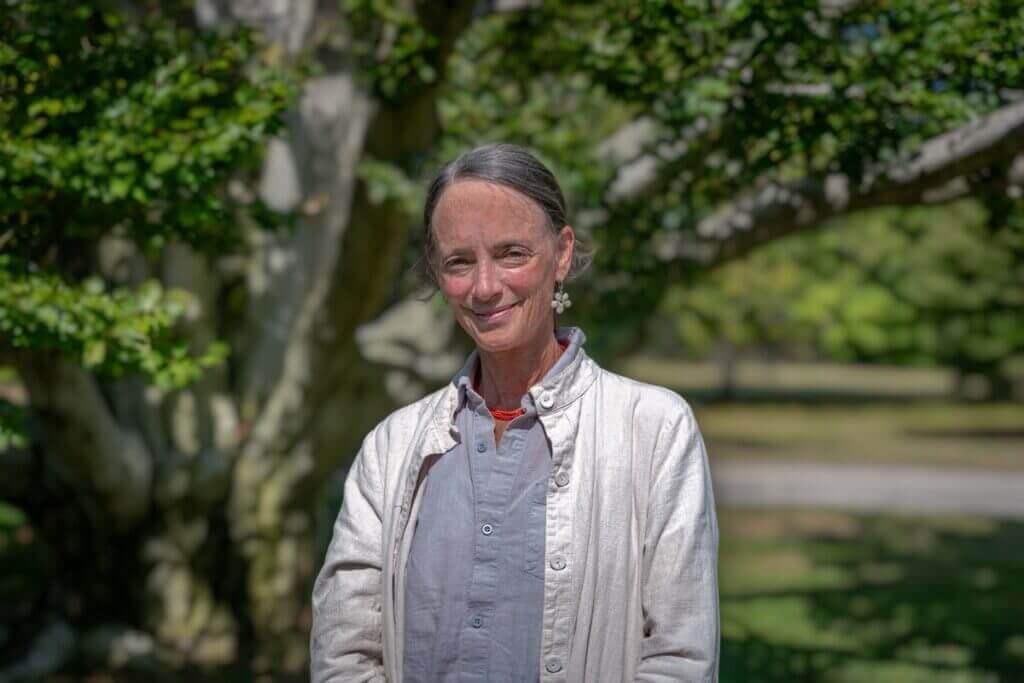 A photo of School and Youth Program Manager, Liz Lightfoot standing outdoors.