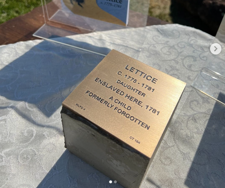 Memorial plaque for Lettice, a child enslaved in 1781, honoring her memory on a textured surface.