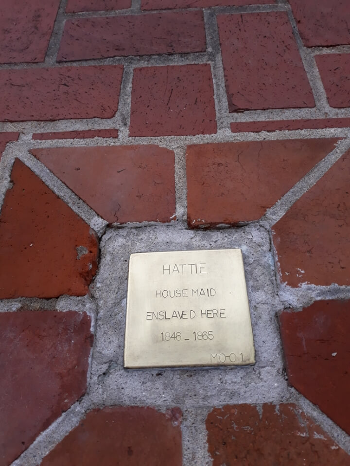 Commemorative plaque for Hattie, enslaved house maid (1846-1865), set in brick pavement.